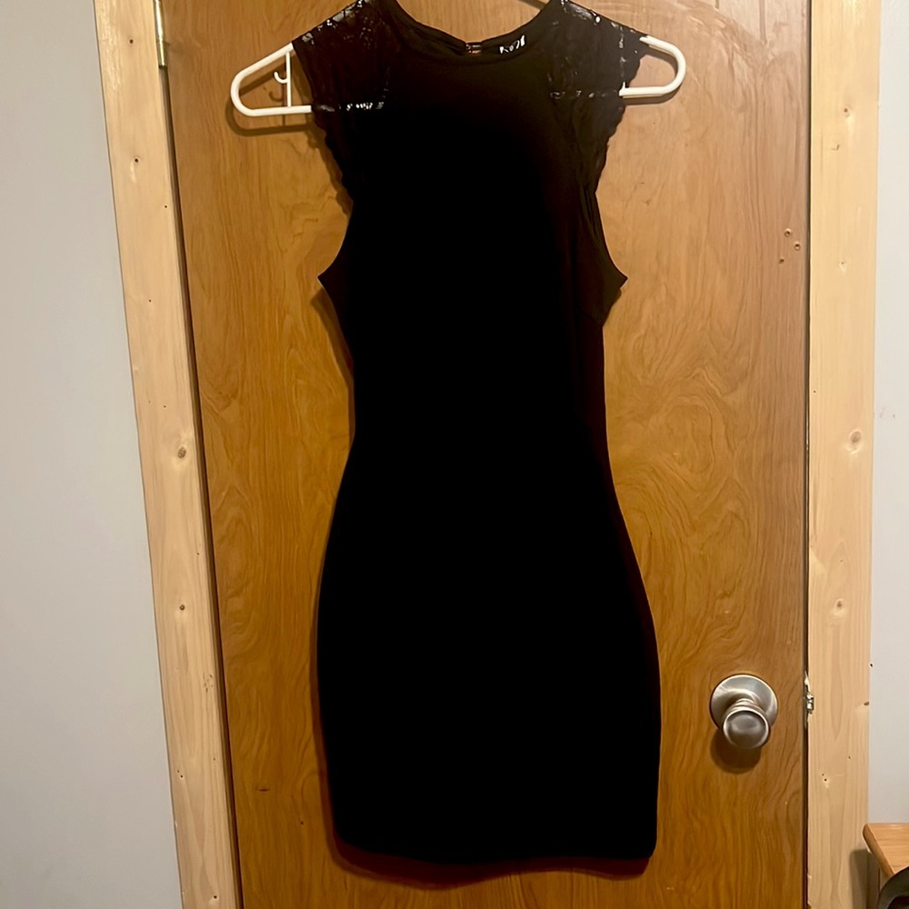 Womens black dress, belly open